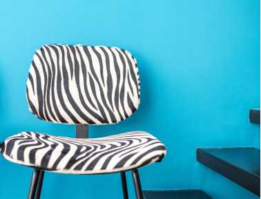 Cowhide chair with armrest