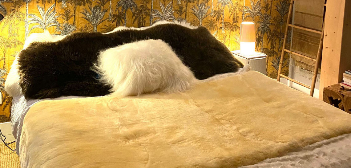 Medical sheepskin blanket on a bed